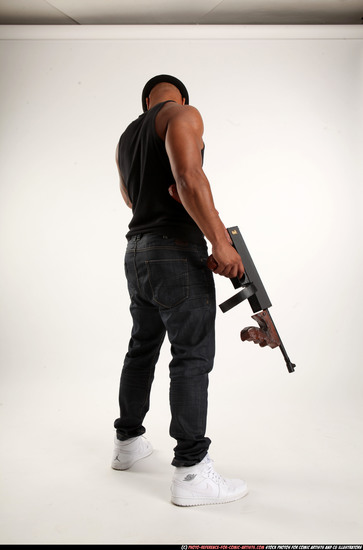 Man Adult Athletic Black Fighting with submachine gun Standing poses Casual