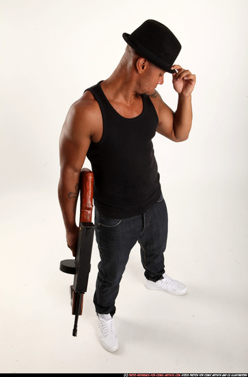 Man Adult Athletic Black Fighting with submachine gun Standing poses Casual