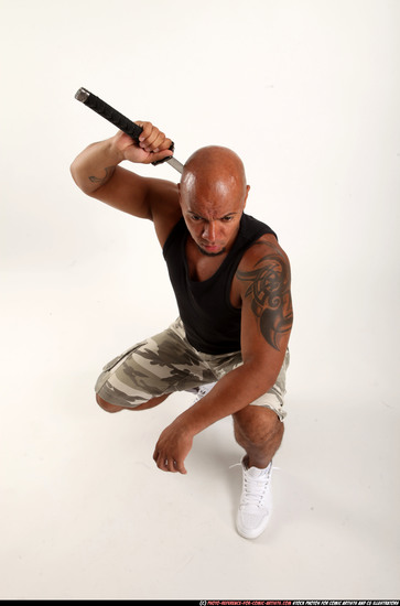 Man Adult Athletic Black Fighting with sword Kneeling poses Army