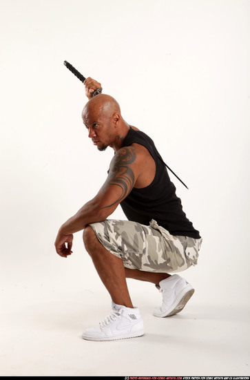 Man Adult Athletic Black Fighting with sword Kneeling poses Army