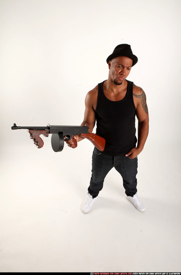 Man Adult Athletic Black Fighting with submachine gun Standing poses Casual