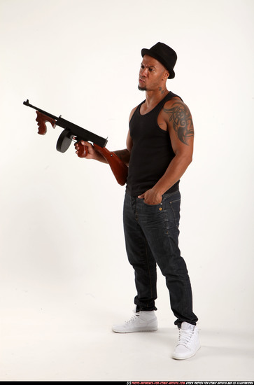 Man Adult Athletic Black Fighting with submachine gun Standing poses Casual