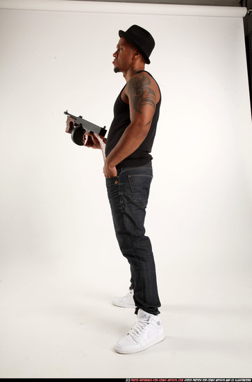 Man Adult Athletic Black Fighting with submachine gun Standing poses Casual