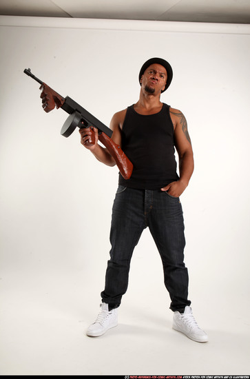 Man Adult Athletic Black Fighting with submachine gun Standing poses Casual