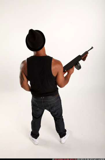 Man Adult Athletic Black Fighting with submachine gun Standing poses Casual