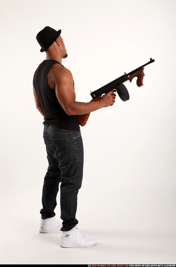 Man Adult Athletic Black Fighting with submachine gun Standing poses Casual