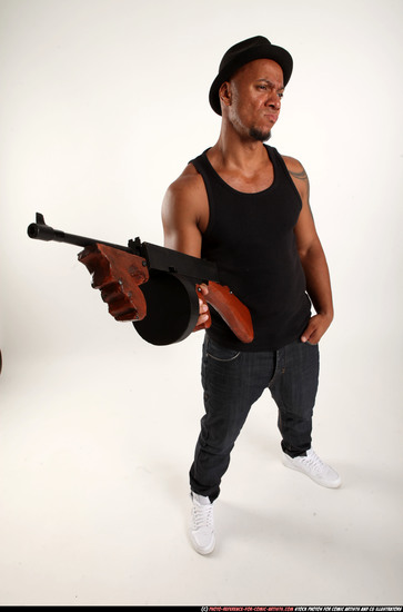 Man Adult Athletic Black Fighting with submachine gun Standing poses Casual