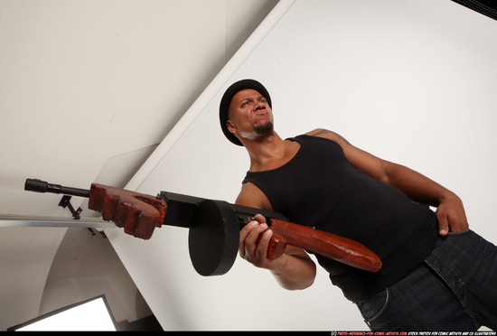 Man Adult Athletic Black Fighting with submachine gun Standing poses Casual