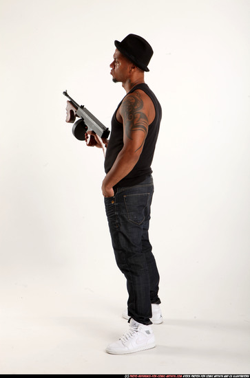 Man Adult Athletic Black Fighting with submachine gun Standing poses Casual