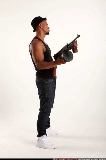 Man Adult Athletic Black Fighting with submachine gun Standing poses Casual