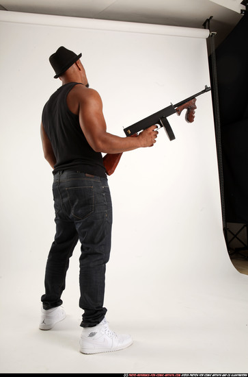 Man Adult Athletic Black Fighting with submachine gun Standing poses Casual