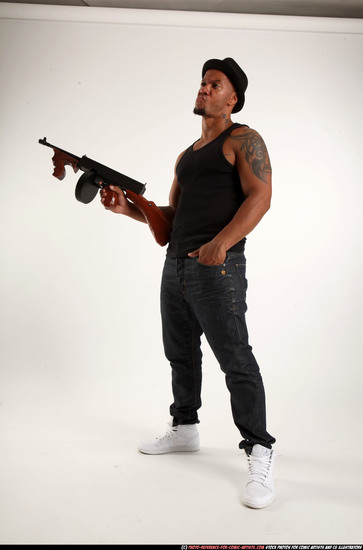 Man Adult Athletic Black Fighting with submachine gun Standing poses Casual