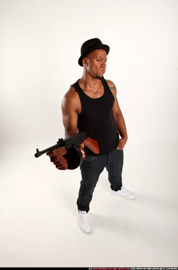 Man Adult Athletic Black Fighting with submachine gun Standing poses Casual