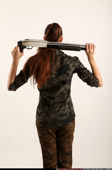 Woman Young Athletic White Standing poses Army Fighting with shotgun