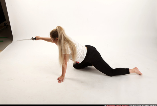 Woman Young Average Fighting with sword Kneeling poses Casual Asian