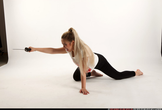 Woman Young Average Fighting with sword Kneeling poses Casual Asian