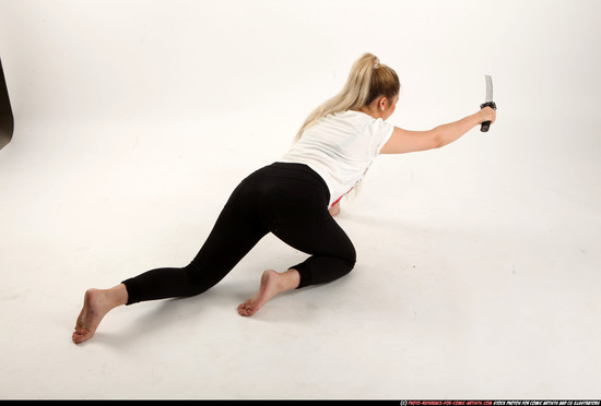 Woman Young Average Fighting with sword Kneeling poses Casual Asian