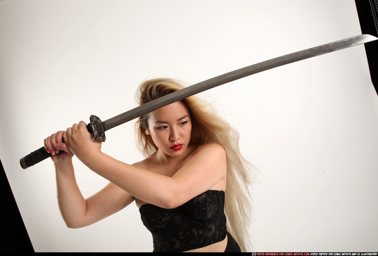 Woman Young Average Fighting with sword Standing poses Casual Asian