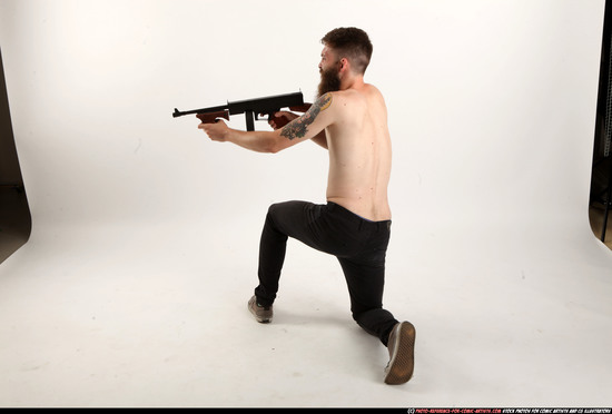 Man Adult Athletic White Fighting with submachine gun Kneeling poses Pants