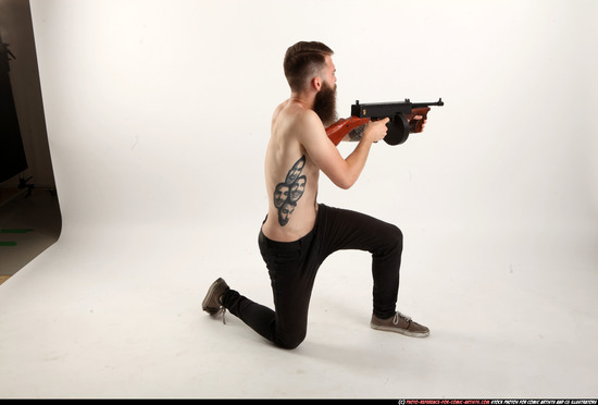 Man Adult Athletic White Fighting with submachine gun Kneeling poses Pants