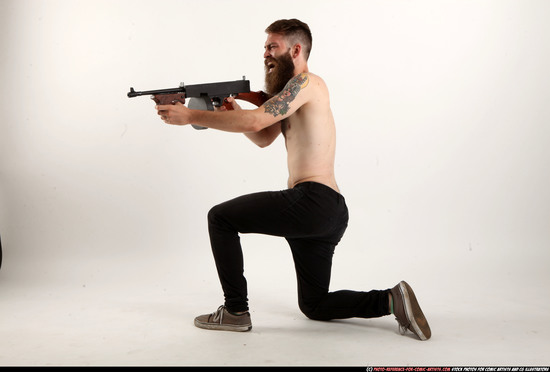 Man Adult Athletic White Fighting with submachine gun Kneeling poses Pants