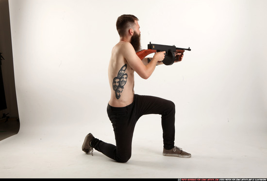 Man Adult Athletic White Fighting with submachine gun Kneeling poses Pants