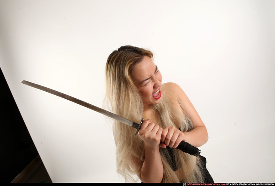 Woman Young Average Fighting with sword Standing poses Casual Asian