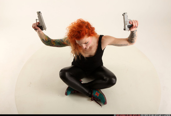 Woman Adult Athletic White Fighting with gun Sitting poses Casual