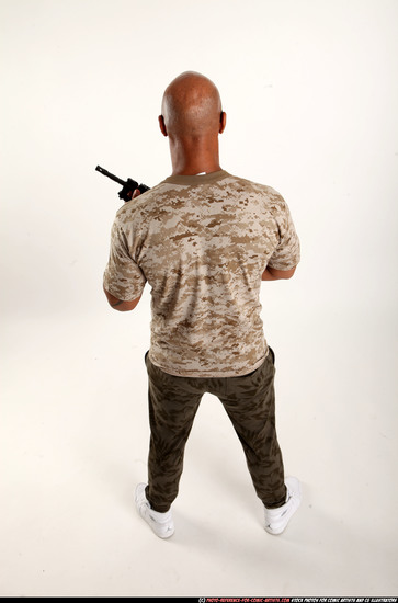 Man Adult Athletic Black Fighting with submachine gun Standing poses Army