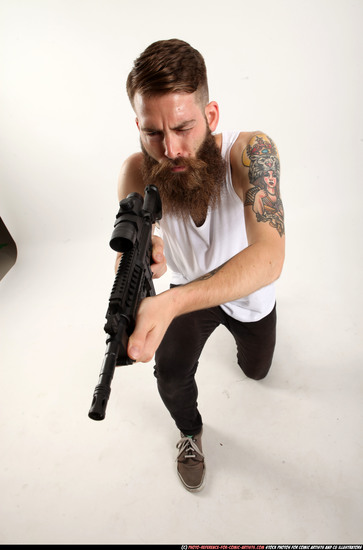 Man Adult Athletic White Fighting with submachine gun Kneeling poses Casual