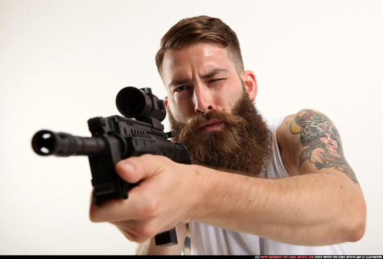 Man Adult Athletic White Fighting with submachine gun Kneeling poses Casual