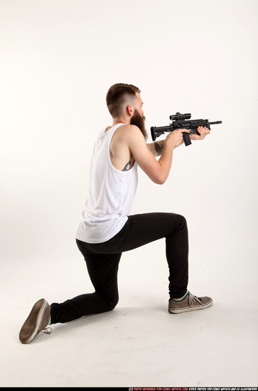 Man Adult Athletic White Fighting with submachine gun Kneeling poses Casual