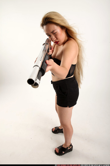 Woman Young Average Standing poses Casual Asian Fighting with shotgun