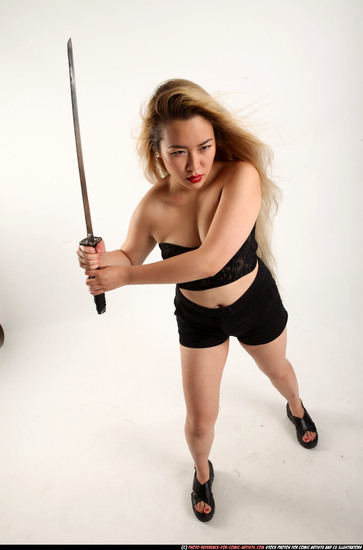 Woman Young Average Fighting with sword Standing poses Casual Asian