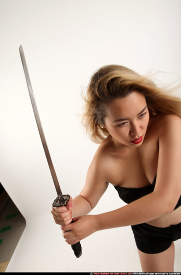 Woman Young Average Fighting with sword Standing poses Casual Asian