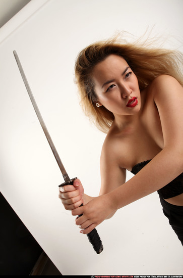 Woman Young Average Fighting with sword Standing poses Casual Asian