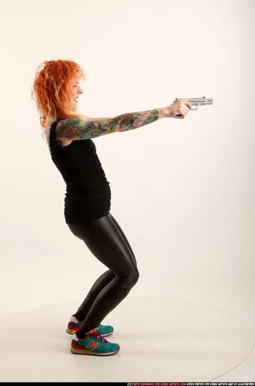 Woman Adult Athletic White Fighting with gun Standing poses Casual