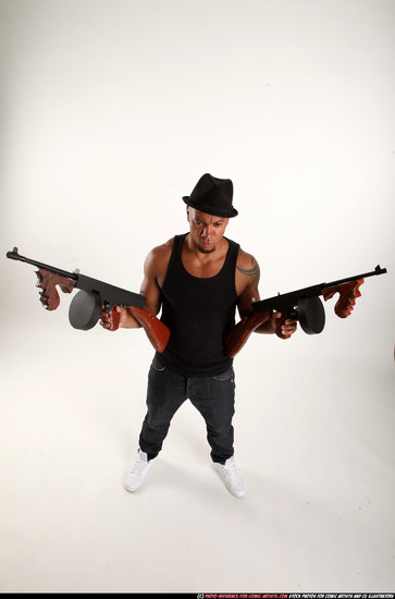 Man Adult Athletic Black Fighting with submachine gun Standing poses Casual