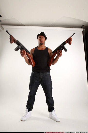 Man Adult Athletic Black Fighting with submachine gun Standing poses Casual