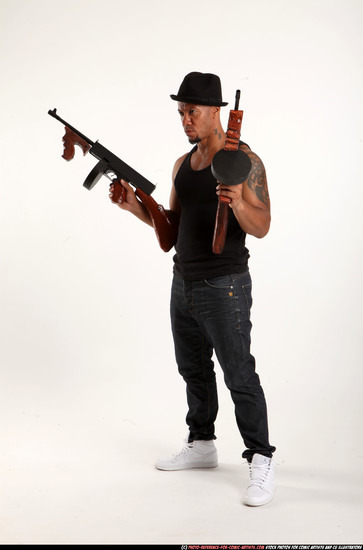 Man Adult Athletic Black Fighting with submachine gun Standing poses Casual