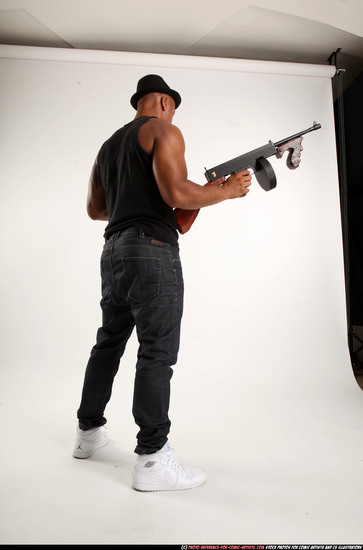 Man Adult Athletic Black Fighting with submachine gun Standing poses Casual