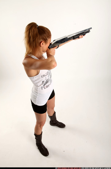 Woman Adult Athletic White Standing poses Casual Fighting with shotgun