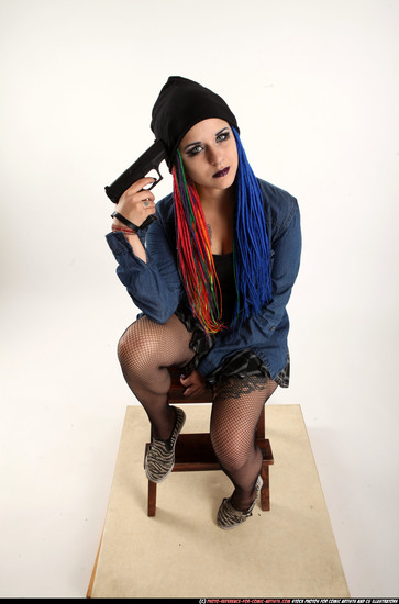 Woman Young Average White Fighting with gun Sitting poses Casual