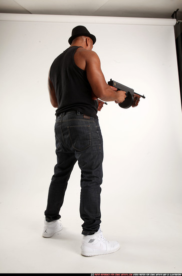 Man Adult Athletic Black Fighting with submachine gun Standing poses Casual