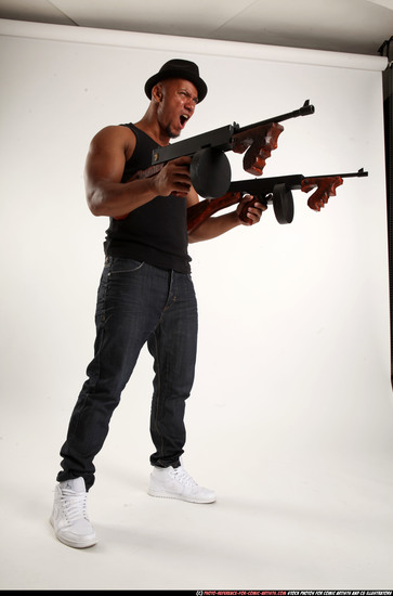 Man Adult Athletic Black Fighting with submachine gun Standing poses Casual