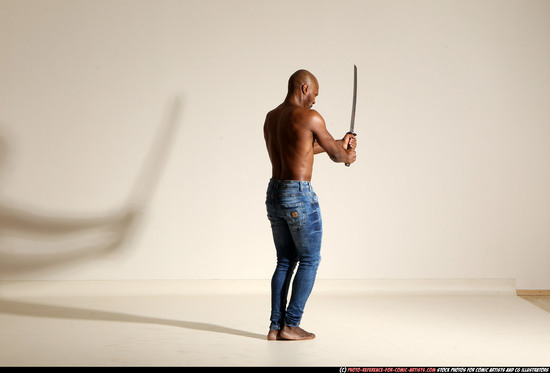 Man Adult Athletic Black Fighting with sword Moving poses Pants