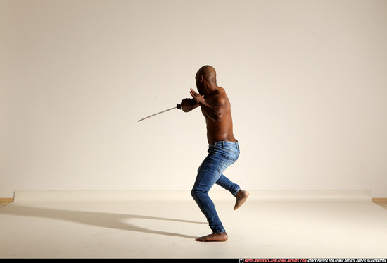 Man Adult Athletic Black Fighting with sword Moving poses Pants