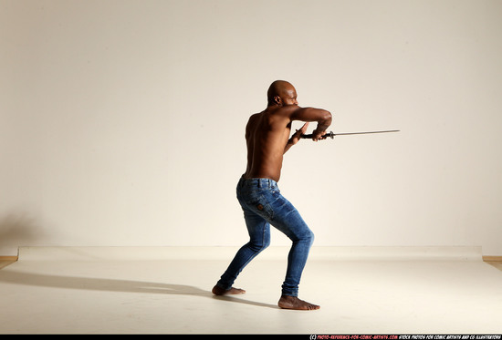 Man Adult Athletic Black Fighting with sword Moving poses Pants