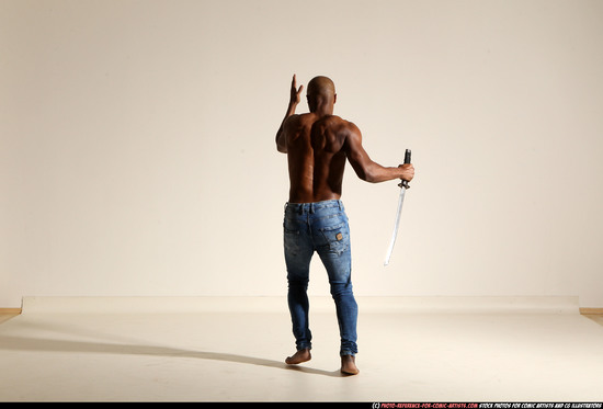 Man Adult Athletic Black Fighting with sword Moving poses Pants