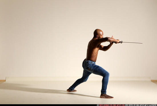 Man Adult Athletic Black Fighting with sword Moving poses Pants